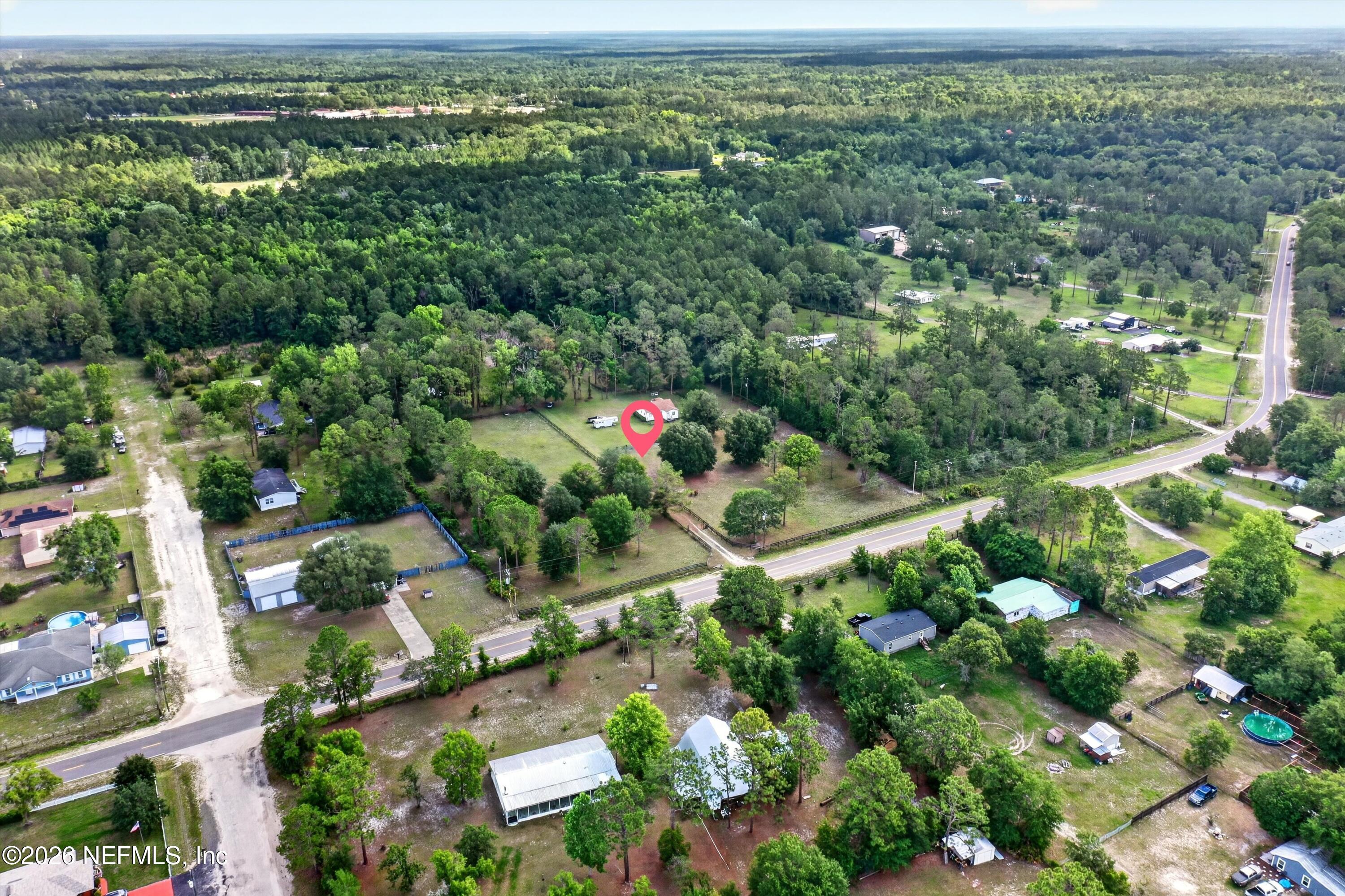 5214 Carter Spencer Road Middleburg, FL 32068 - Photo 49 of 50 an aerial view of residential houses with outdoor space and trees