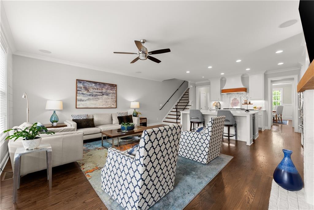 3206 Ridge Towne Place Duluth, GA 30096 - Photo 13 of 42 a living room with furniture kitchen view and a wooden floor