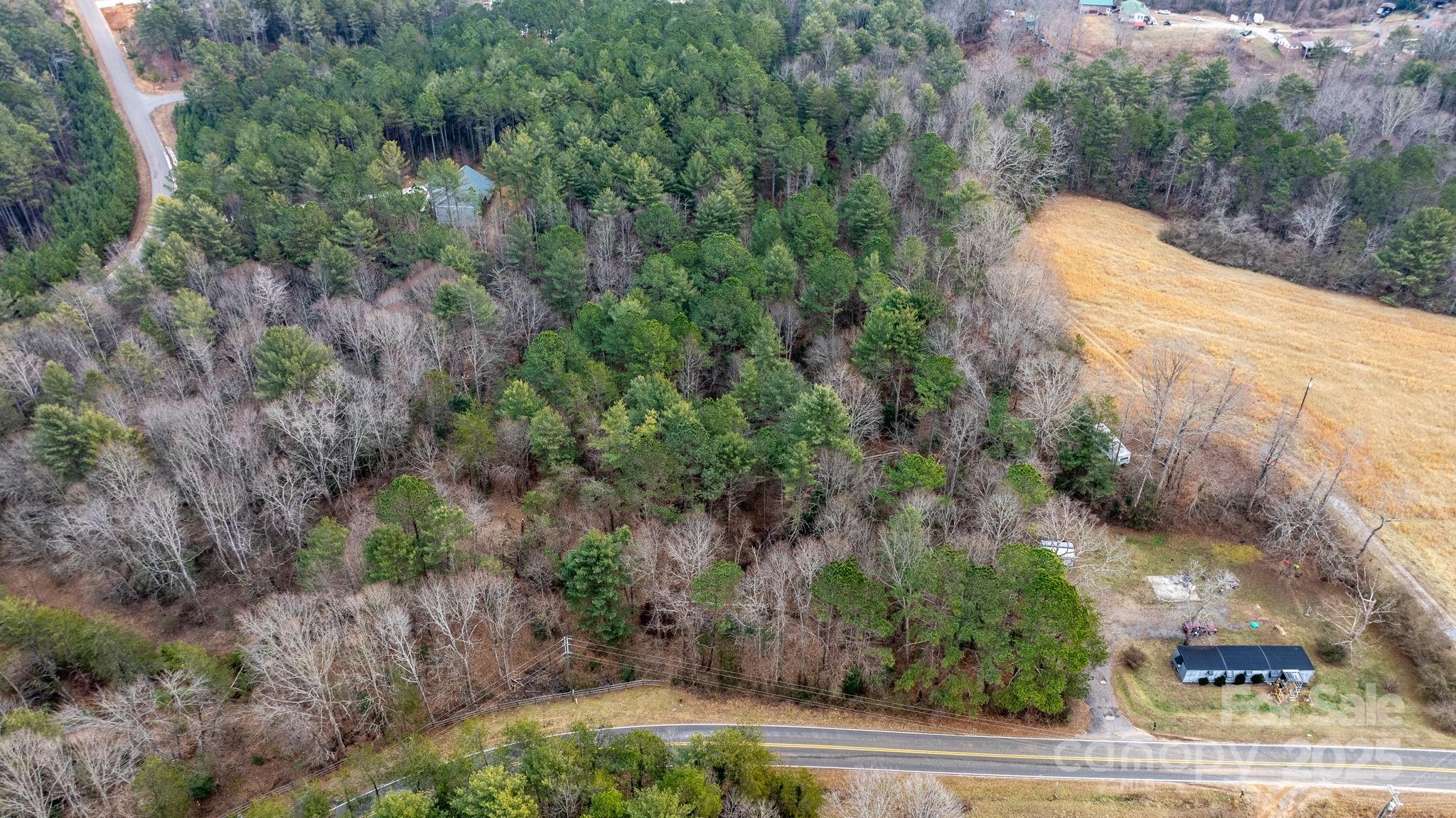 4753 John Berry Road Valdese, NC 28690 - Photo 16 of 28 an aerial view of a house with a yard basket ball court and outdoor seating