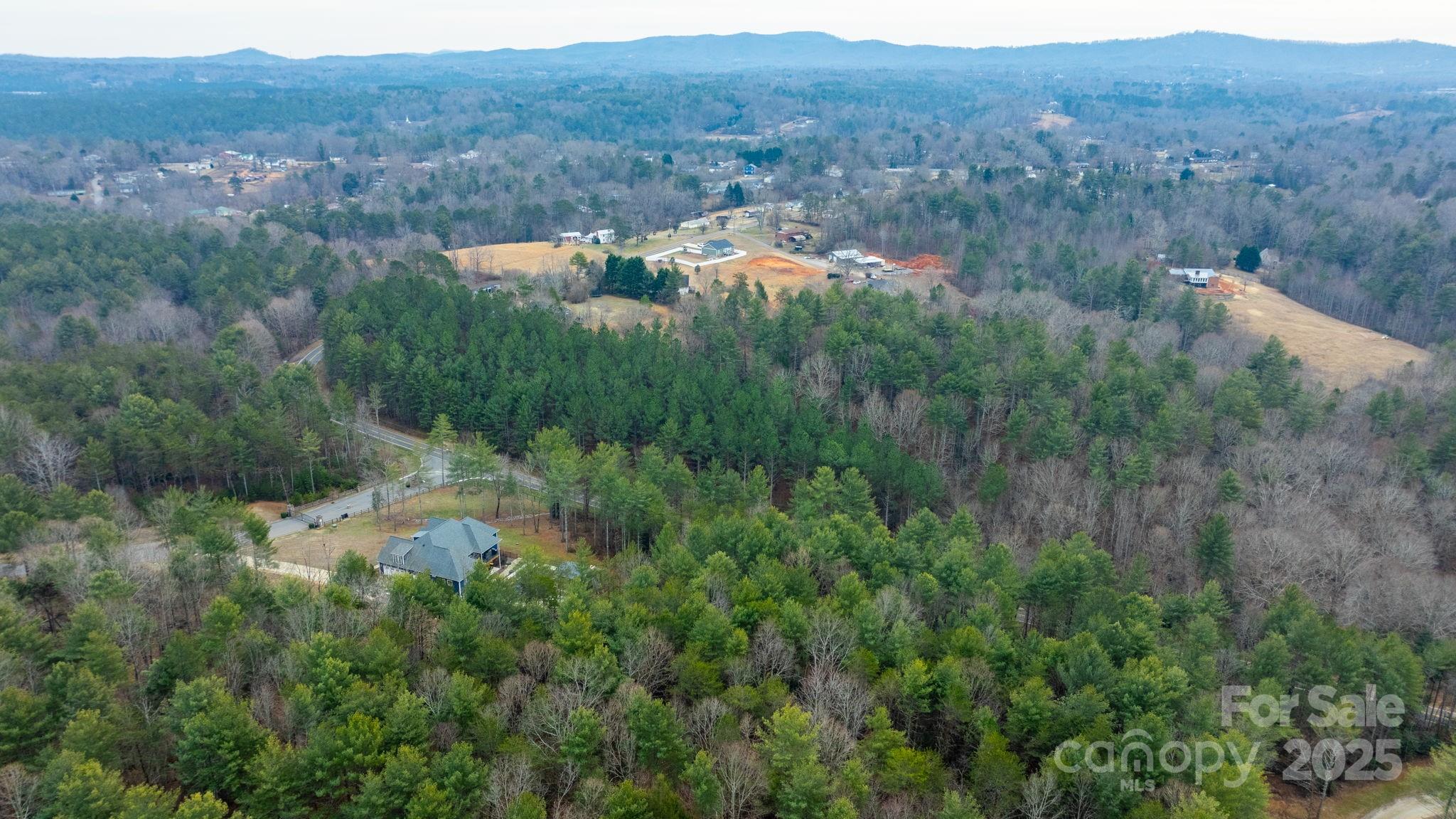 4753 John Berry Road Valdese, NC 28690 - Photo 22 of 28 a view of a lush green hillside and houses