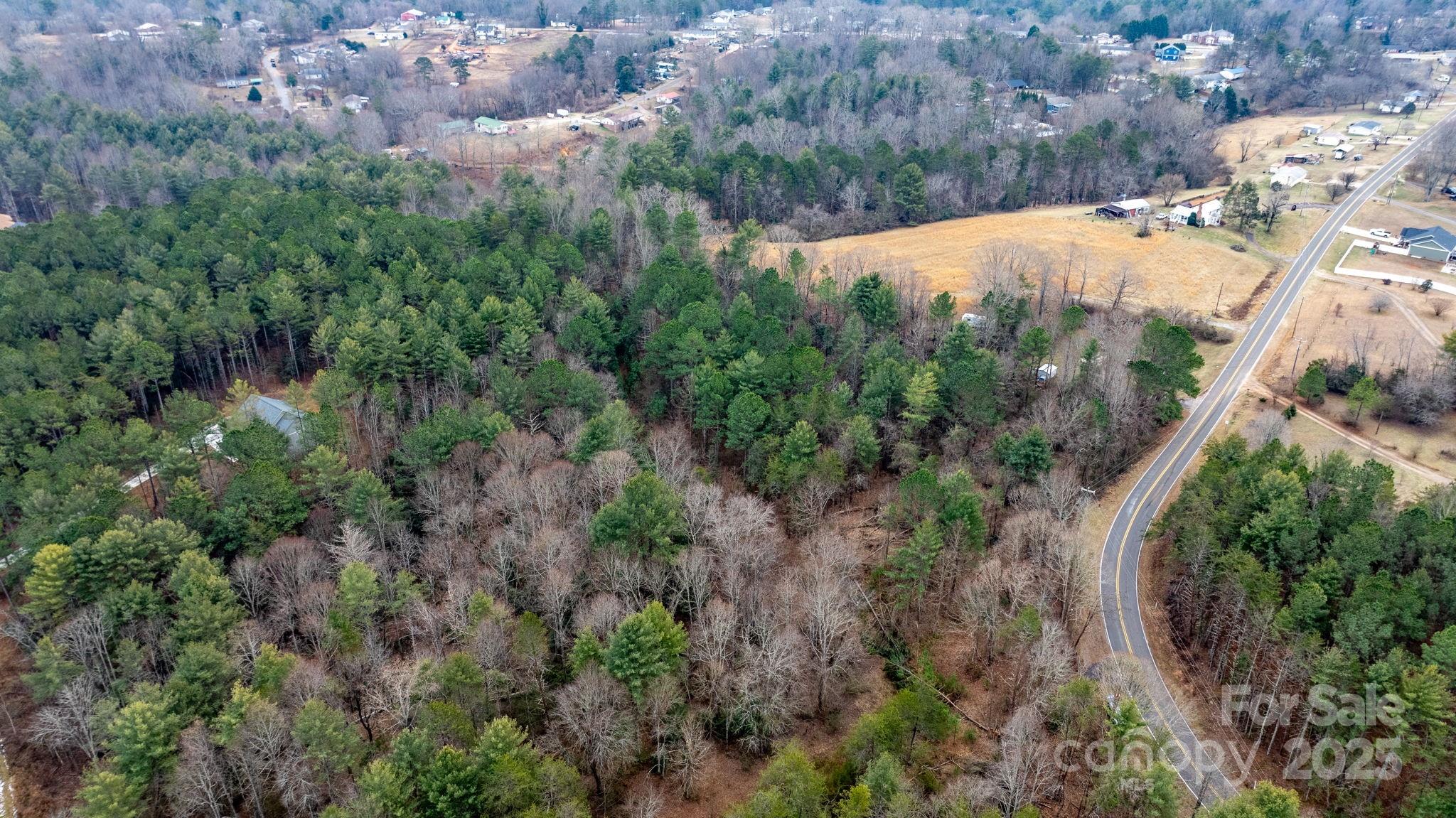 4753 John Berry Road Valdese, NC 28690 - Photo 3 of 28 an aerial view of residential houses with outdoor space and trees