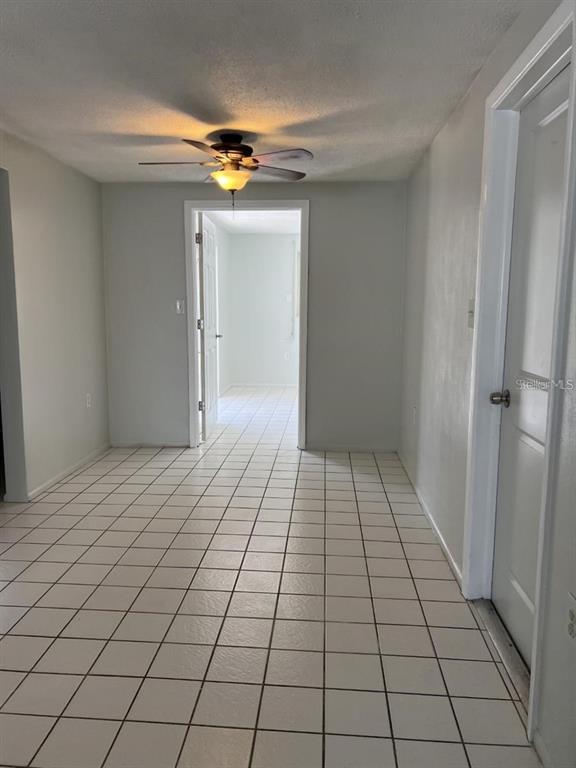 9011 St Clair Lane Port Richey, FL 34668 - Photo 13 of 20 a view of a livingroom with an empty space and a window