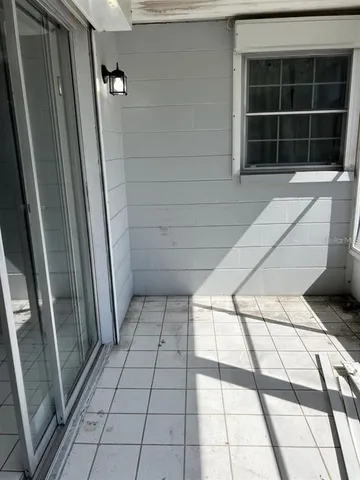 a view of empty room with windows