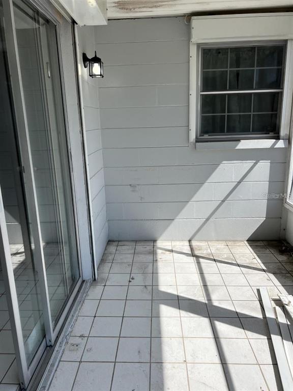 9011 St Clair Lane Port Richey, FL 34668 - Photo 14 of 20 a view of empty room with windows