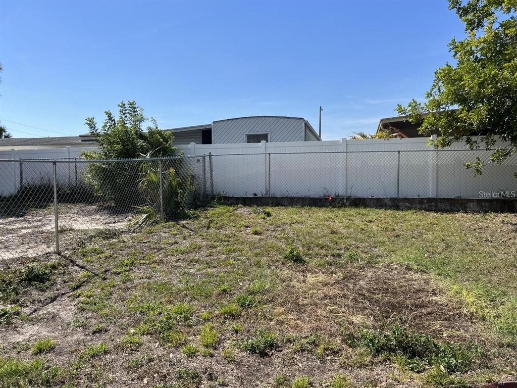 9011 St Clair Lane Port Richey, FL 34668 - Photo 17 of 20 a view of a backyard