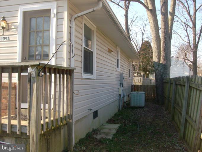 409 Circle Road Riva, MD 21140 - Photo 2 of 18 a view of a patio with a table and chairs and wooden fence