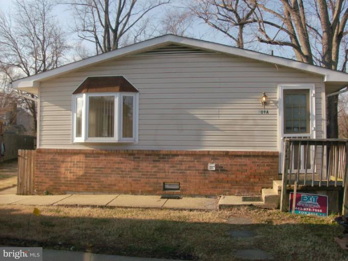 409 Circle Road Riva, MD 21140 - Photo 15 of 18 a front view of a house with a yard