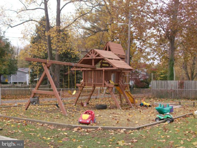 409 Circle Road Riva, MD 21140 - Photo 3 of 18 a view of a wooden house with a yard