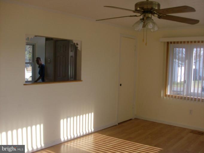 409 Circle Road Riva, MD 21140 - Photo 10 of 18 a view of a room that has a window and wooden floor