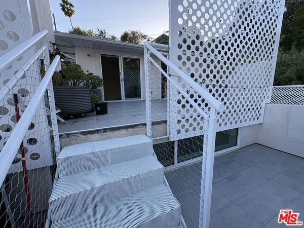 a view of a porch with wooden floor