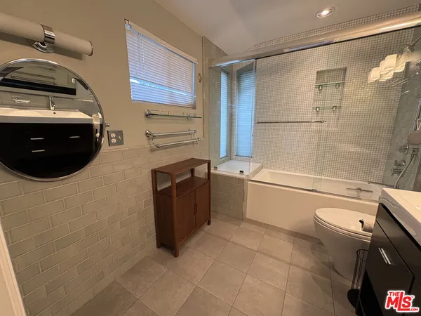 a bathroom with a bathtub toilet and sink