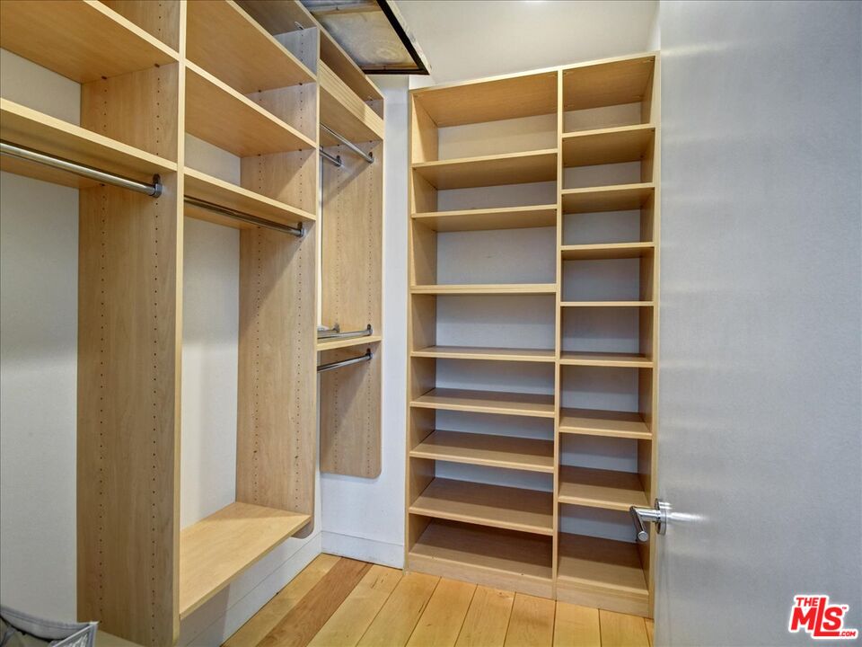 18084 Rancho Street Encino, CA 91316 - Photo 24 of 45 a view of walk in closet with empty racks