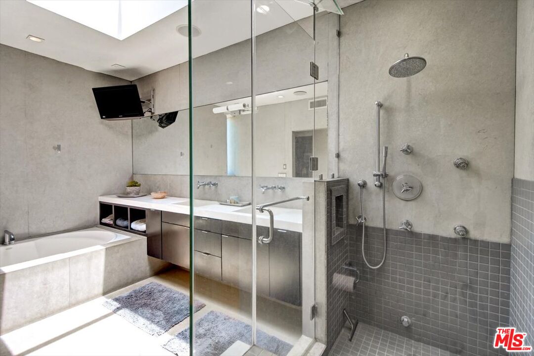 18084 Rancho Street Encino, CA 91316 - Photo 31 of 45 a bathroom with a shower and a sink