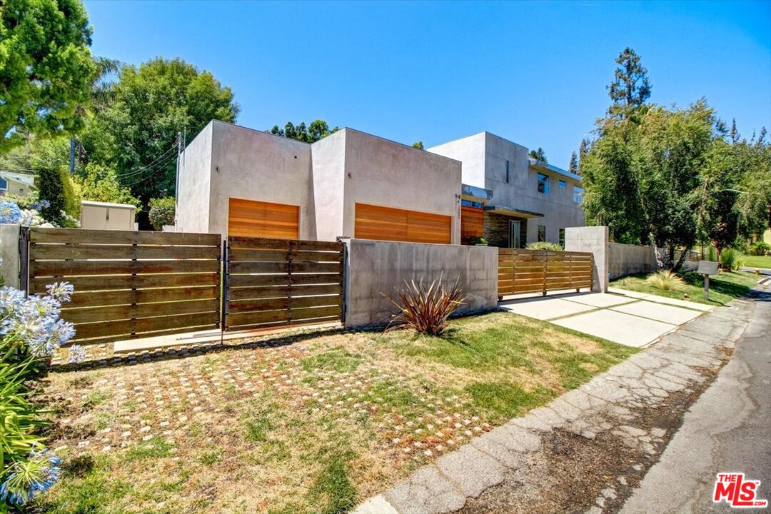 18084 Rancho Street Encino, CA 91316 - Photo 4 of 45 a view of a house with a snow