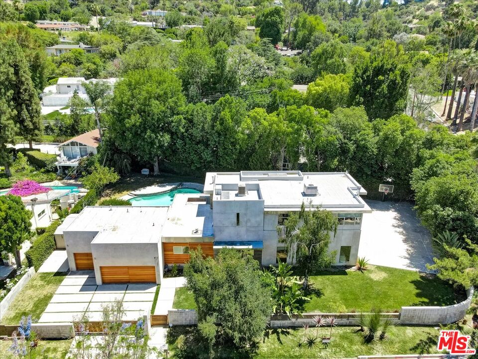 18084 Rancho Street Encino, CA 91316 - Photo 42 of 45 an aerial view of a house with a yard