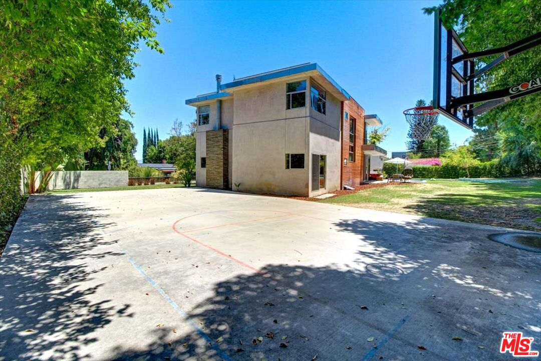 18084 Rancho Street Encino, CA 91316 - Photo 9 of 45 a view of a house with a yard