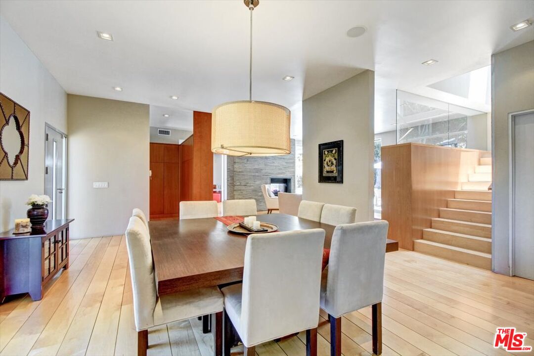 18084 Rancho Street Encino, CA 91316 - Photo 10 of 45 a view of a dining room with furniture window and wooden floor