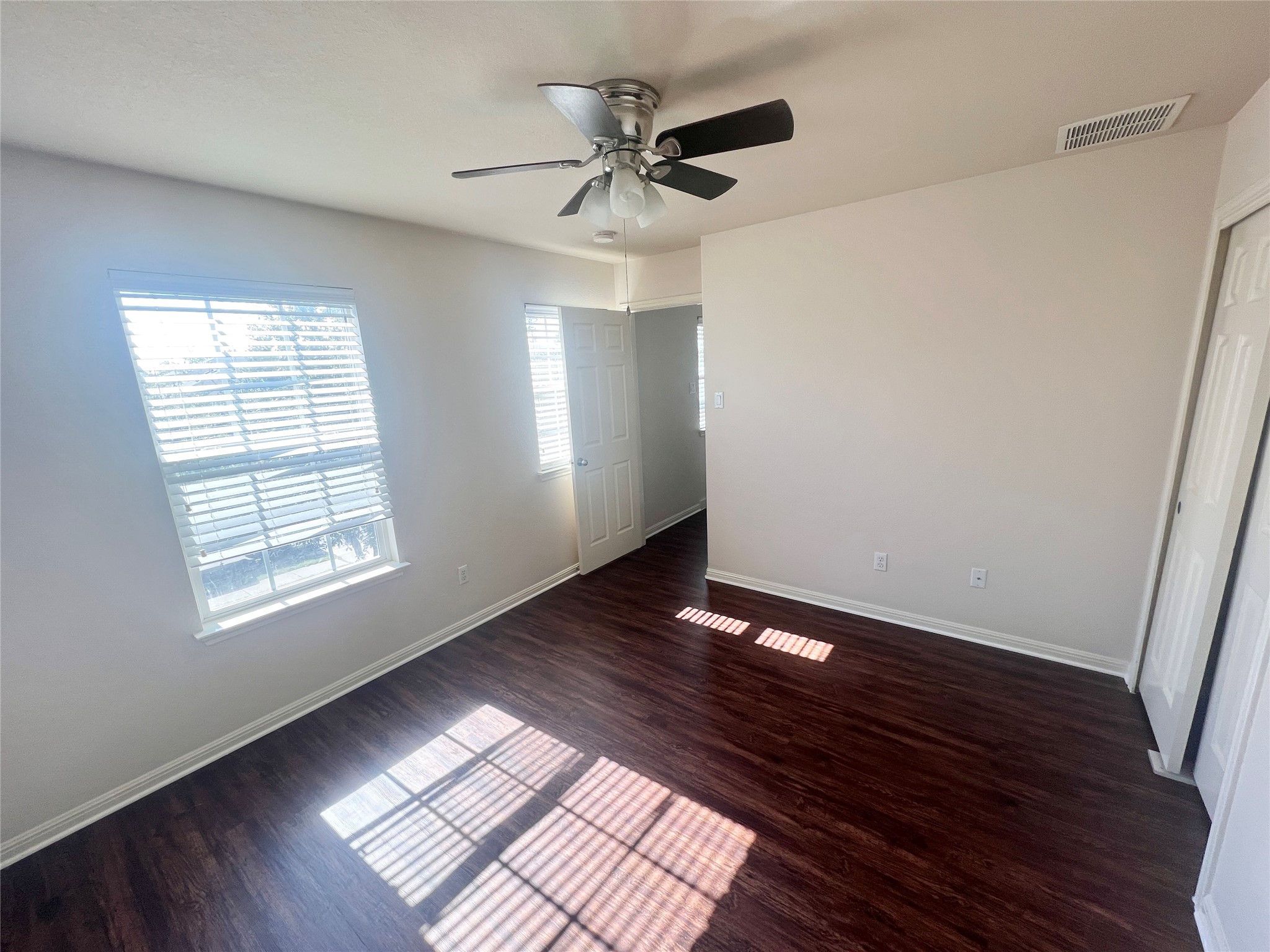 476 Nottingham Loop Kyle, TX 78640 - Photo 13 of 29 a view of an empty room with wooden floor and a window