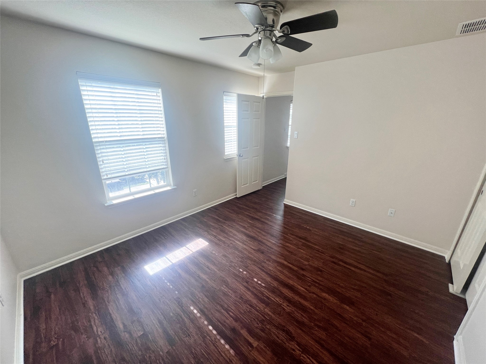 476 Nottingham Loop Kyle, TX 78640 - Photo 14 of 29 wooden floor in an empty room with a window