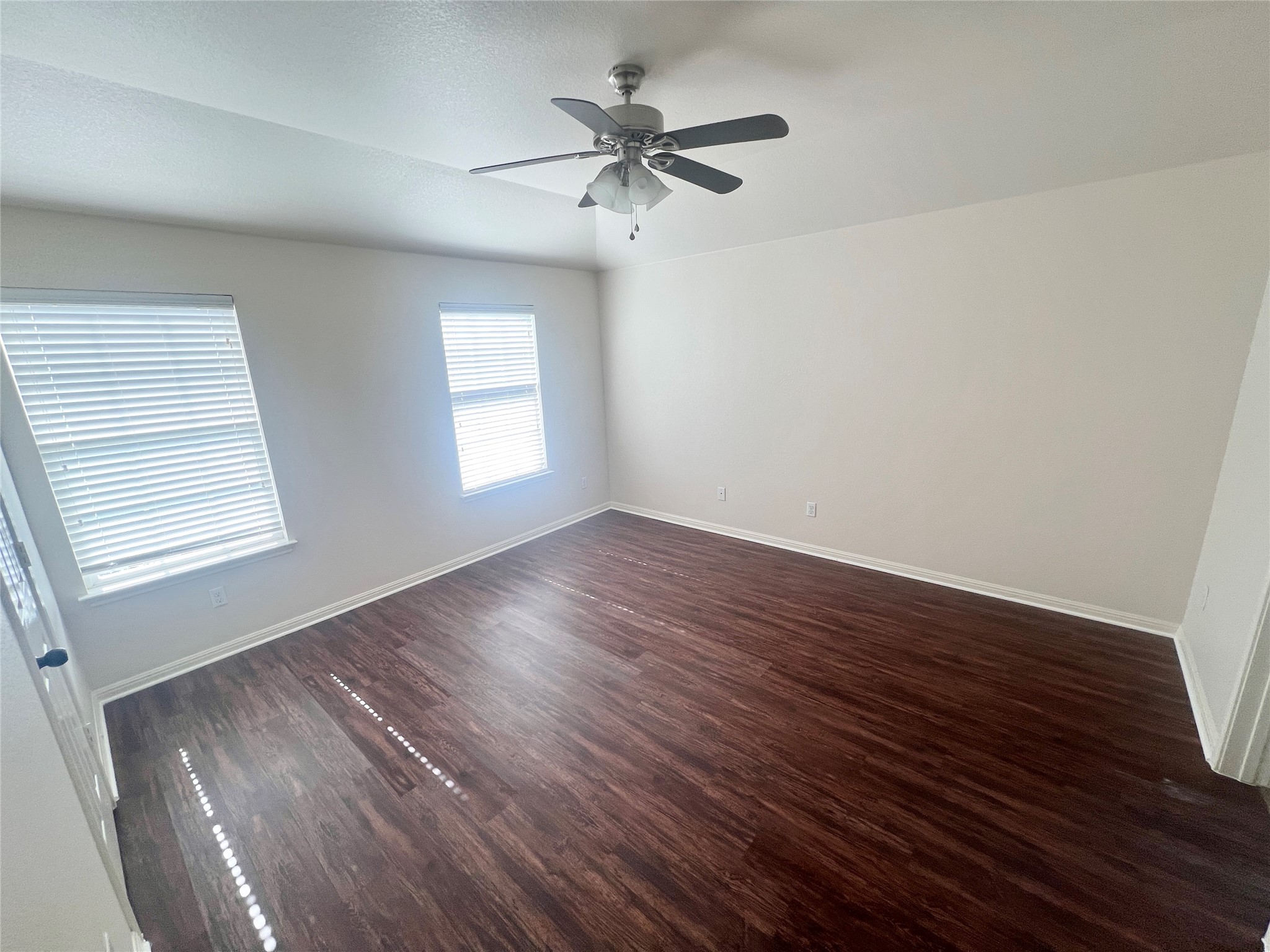 476 Nottingham Loop Kyle, TX 78640 - Photo 19 of 29 wooden floor in an empty room with a window