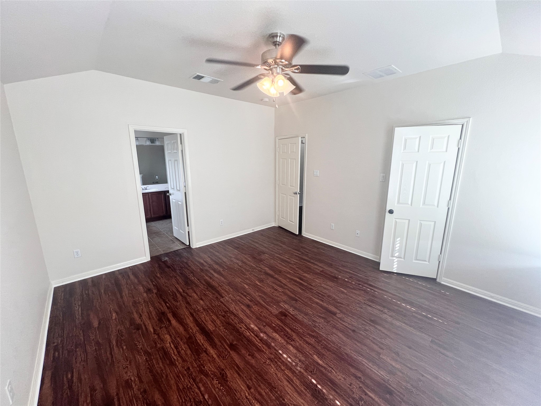 476 Nottingham Loop Kyle, TX 78640 - Photo 21 of 29 a view of a livingroom with wooden floor and a ceiling fan
