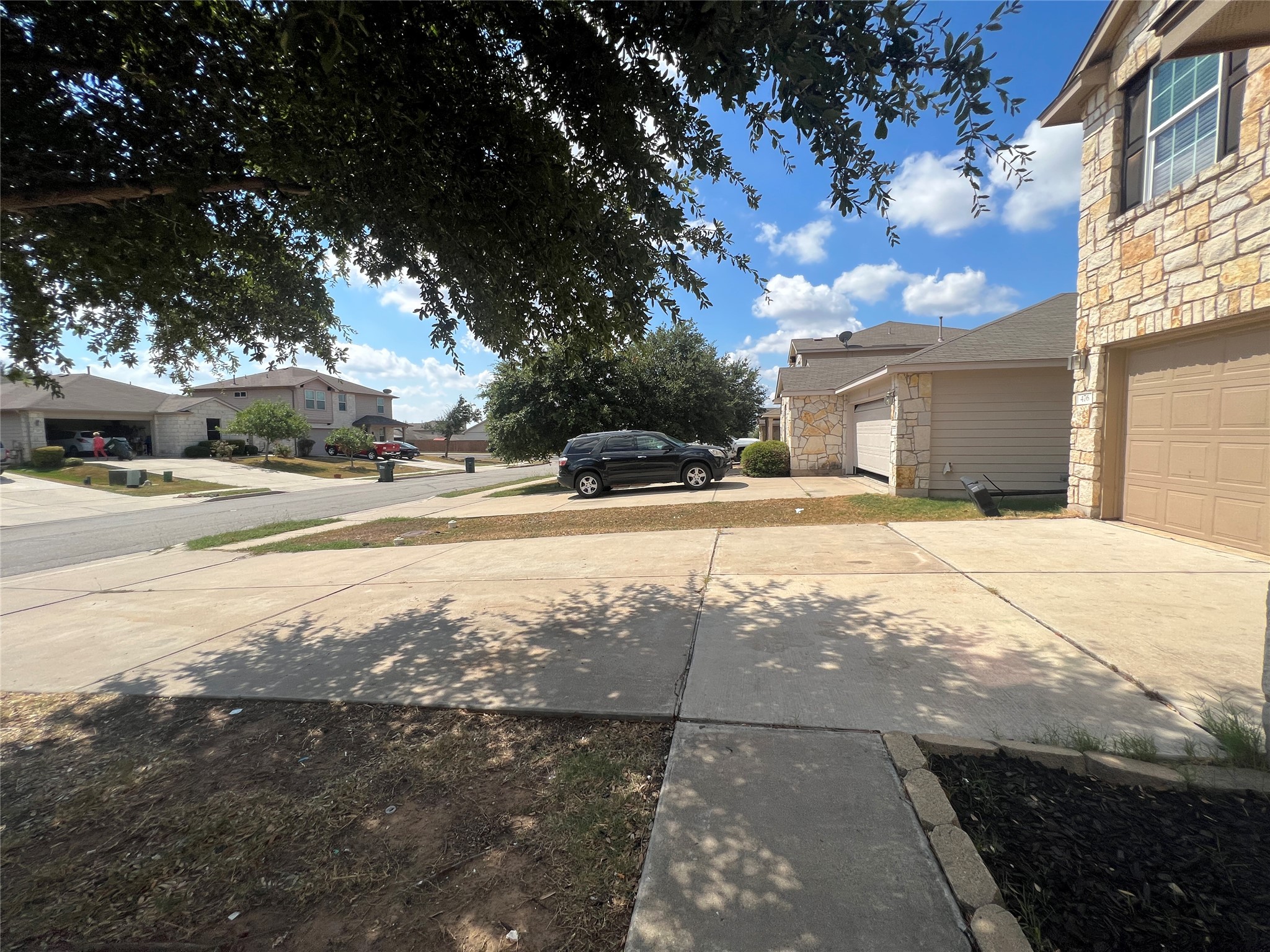 476 Nottingham Loop Kyle, TX 78640 - Photo 24 of 29 a view of road with large trees