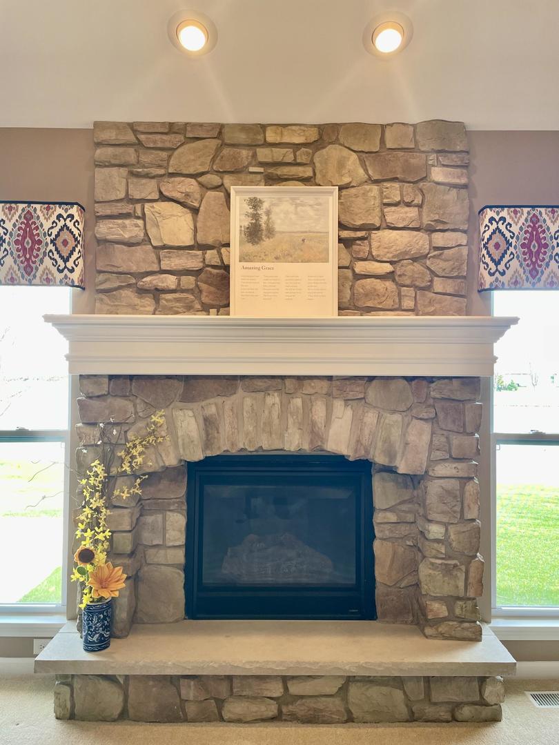 1150 Bailey Road Sycamore, IL 60178 - Photo 17 of 28 a fireplace with a hallway