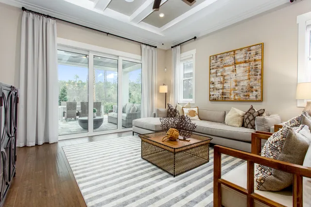a living room with lots of furniture and a chandelier