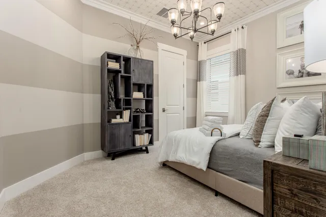 a large bed sitting in a bedroom next to a bathroom