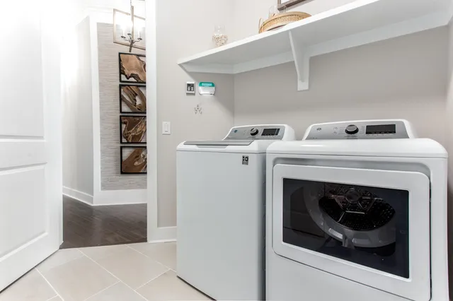 a bathroom with a granite countertop sink a toilet and bathtub