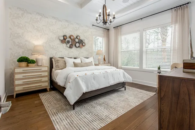 a bedroom with a large bed and a window