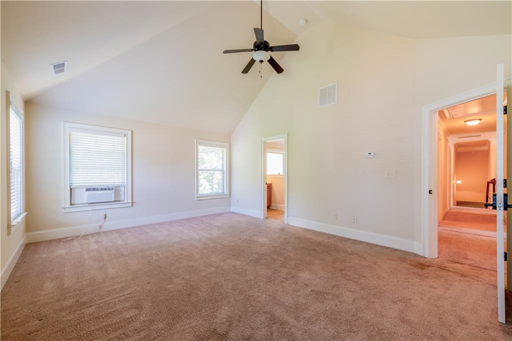 1412 Turnbridge Walk Hampton, GA 30228 - Photo 23 of 40 a view of empty room with a ceiling fan