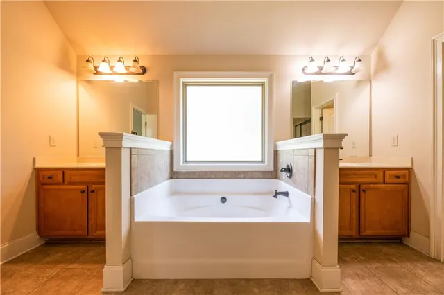 a view of an empty room and a window