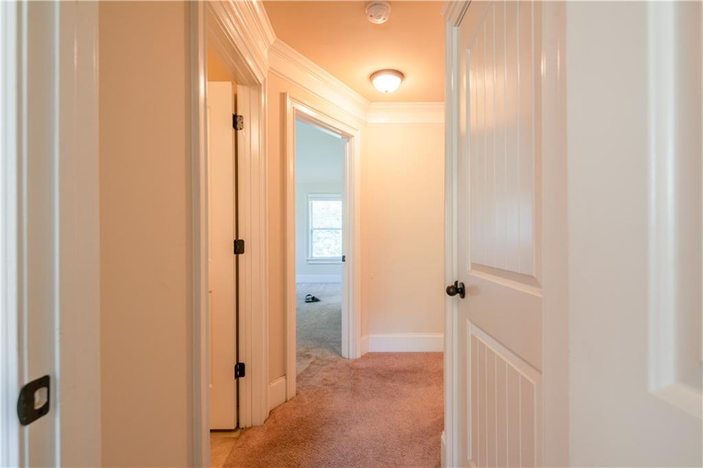 1412 Turnbridge Walk Hampton, GA 30228 - Photo 27 of 40 a bathroom with a shower and a glass door