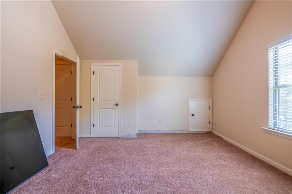 1412 Turnbridge Walk Hampton, GA 30228 - Photo 29 of 40 an empty room with windows and closet