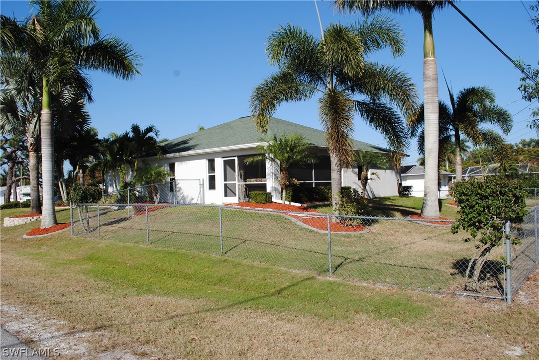 5891 Tarpon Road Bokeelia, FL 33922 - Photo 2 of 25 a view of a house with basketball court