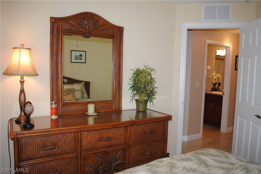 5891 Tarpon Road Bokeelia, FL 33922 - Photo 24 of 25 a living room with furniture and a mirror