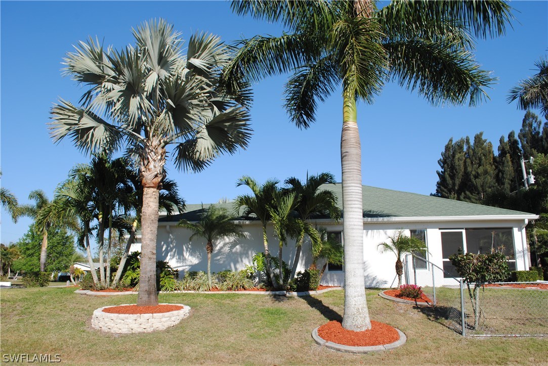 5891 Tarpon Road Bokeelia, FL 33922 - Photo 4 of 25 a swimming pool with outdoor seating