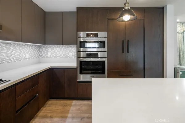 a view of a livingroom with furniture and wooden floor