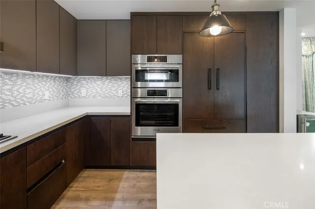 a view of a livingroom with furniture and wooden floor