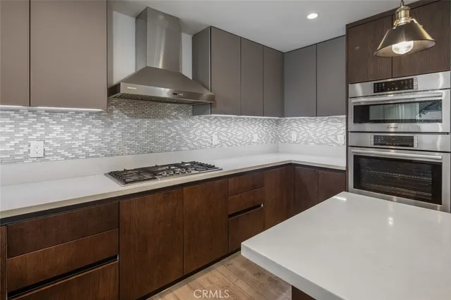 a bathroom with a sink vanity mirror and toilet