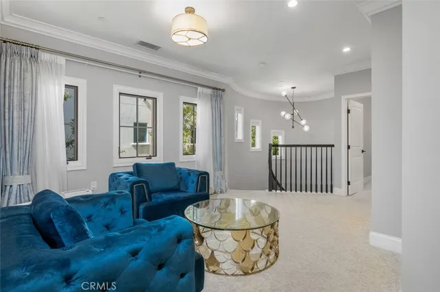a bedroom with bed and large windows