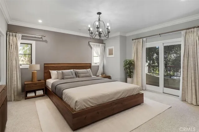 a bedroom with a bed and a potted plant