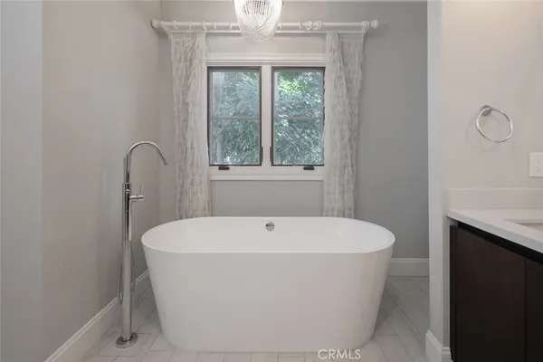 a view of kitchen and hall with wooden floor