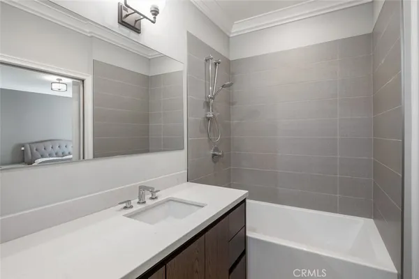 a front view of a house with garden and plants