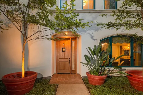 a view of a dining room with furniture wooden floor and chandelier