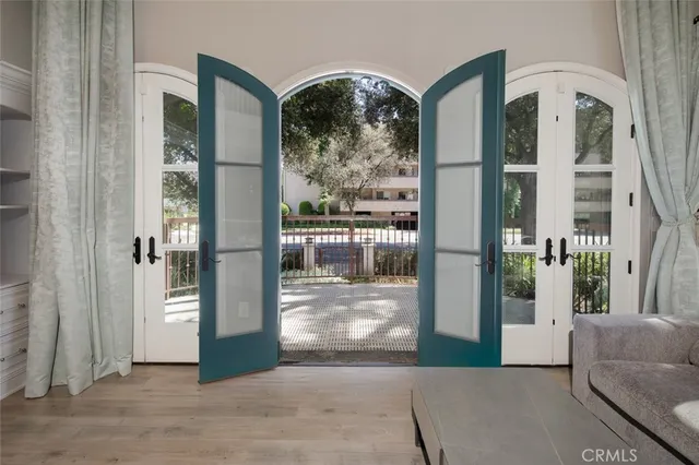 a living room with furniture dining table and a fireplace