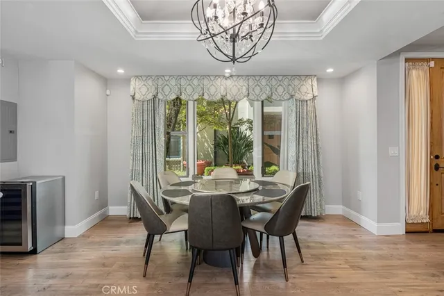 a kitchen with stainless steel appliances a refrigerator sink and wooden cabinets