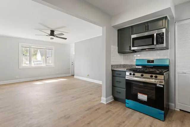 a kitchen with a stove and a microwave