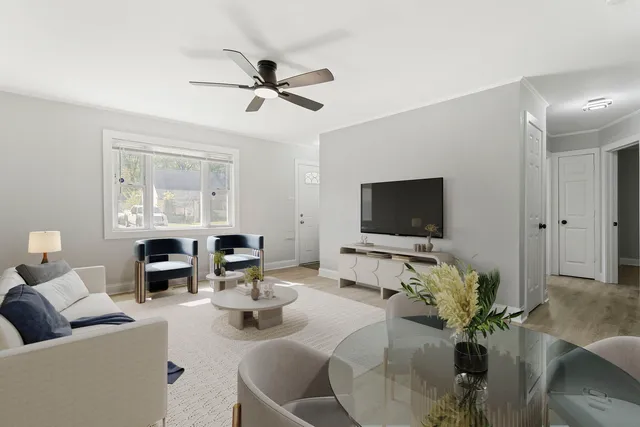 a living room with fireplace furniture and a flat screen tv